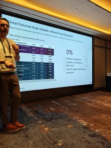 A speaker presenting clinical outcome data on a large screen during the Motiva Preservé Roundtable in Seoul